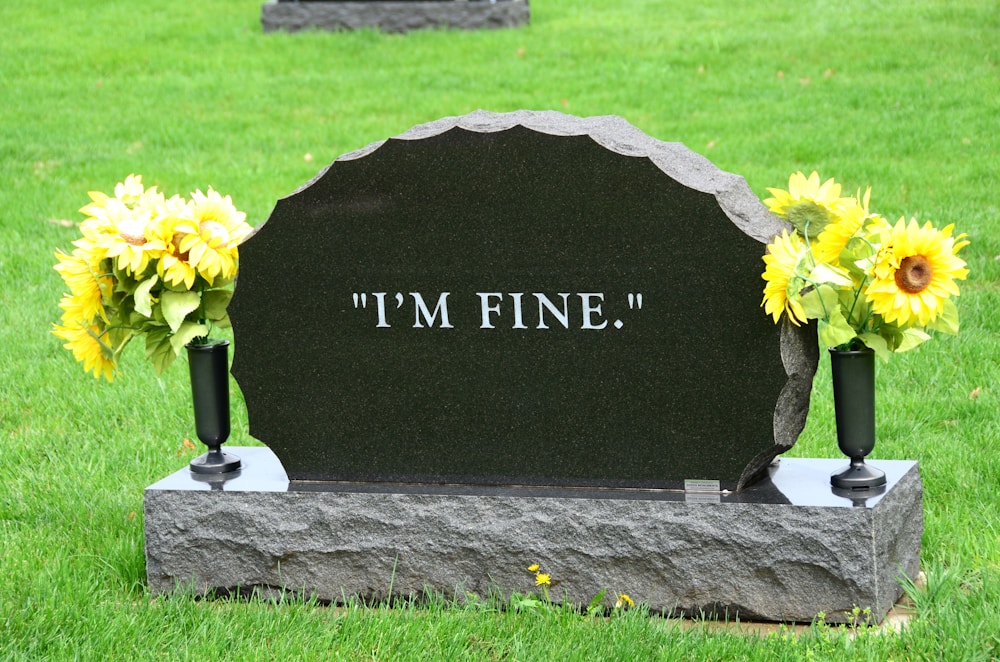 Headstone with flowers in a cemetery