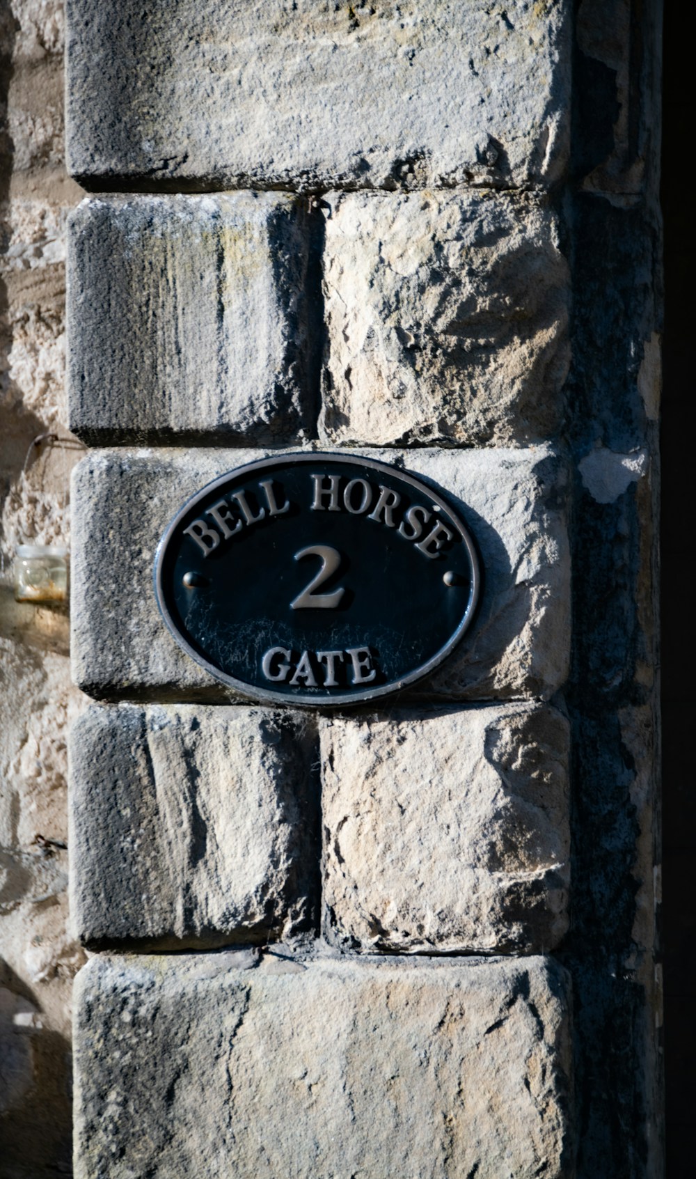 Text and number sign on stone