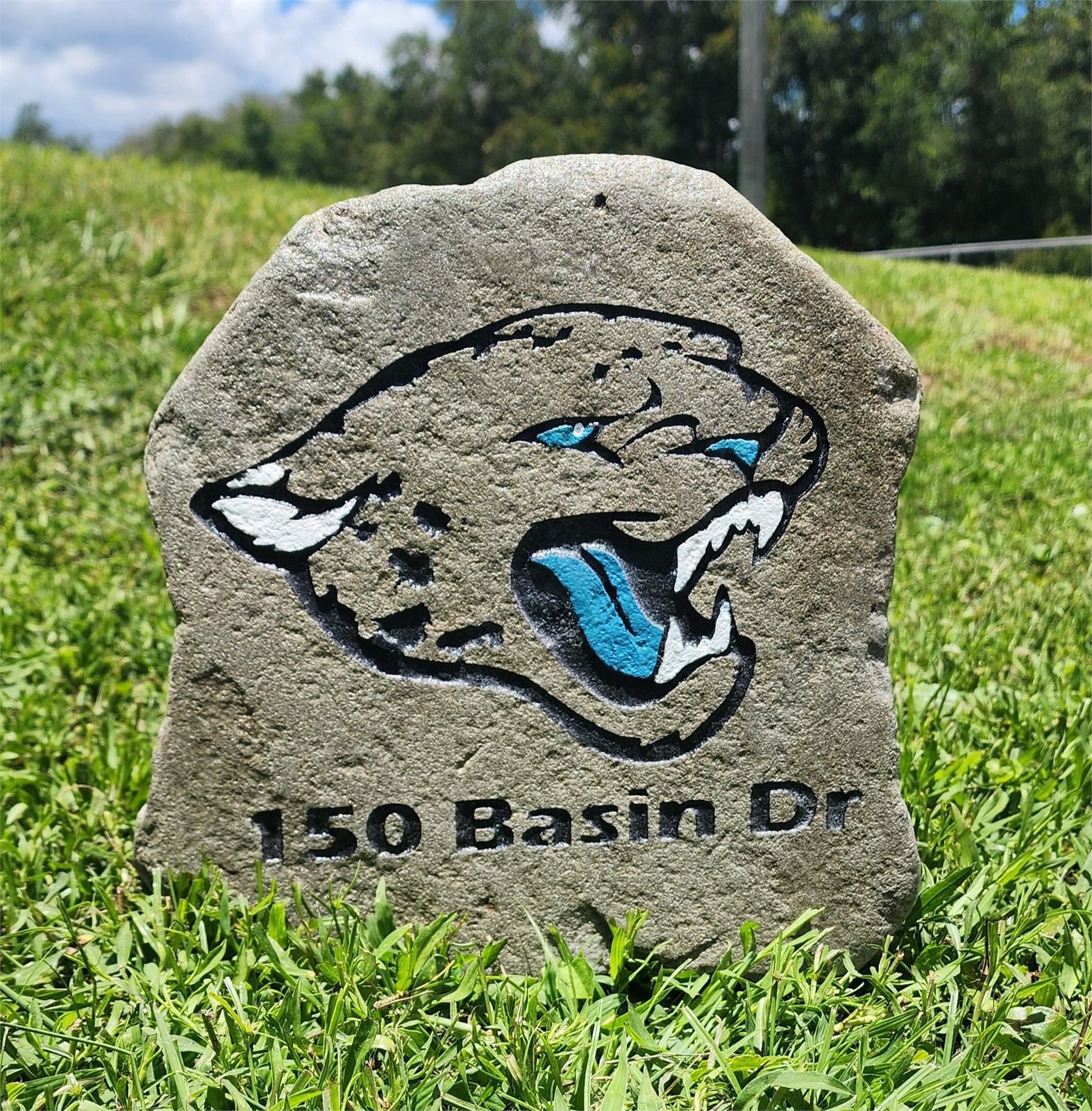 Custom jaguar design engraved and painted on stone