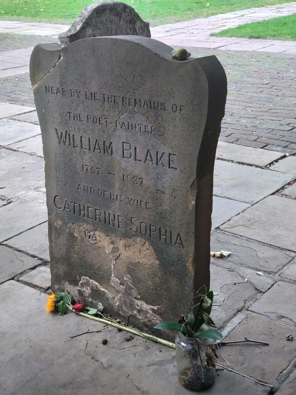 Cemetery headstone with flowers